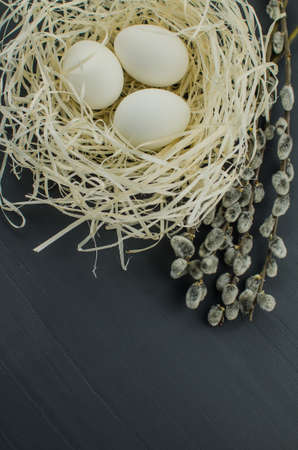 egg white on straw. chicken egg in the nestの写真素材
