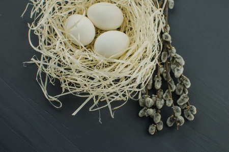 egg white on straw. chicken egg in the nestの写真素材