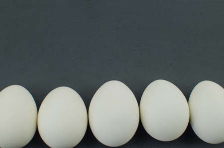 egg white on straw. chicken egg in the nestの写真素材