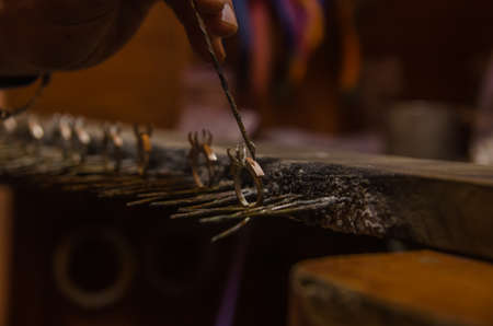 Attacking gold on a silver jewelry. Jewelery workの写真素材