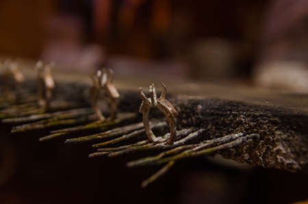 Attacking gold on a silver jewelry. Jewelery workの写真素材