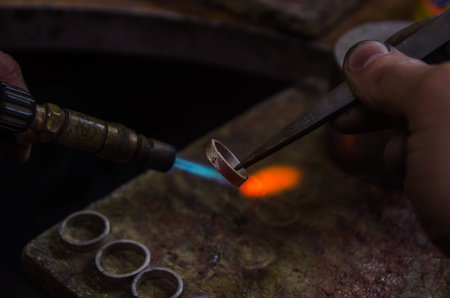 Craft jewelery making with professional tools. A handmade jeweler process, manufacture of jewellery....