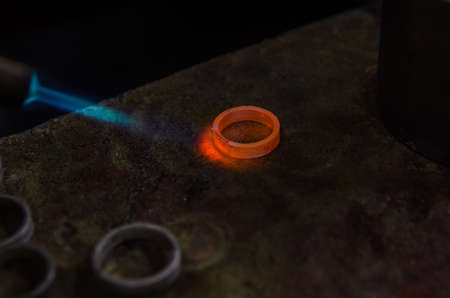 Craft jewelery making with professional tools. A handmade jeweler process, manufacture of jewellery. Melting metalの写真素材