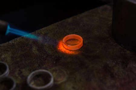 Craft jewelery making with professional tools. A handmade jeweler process, manufacture of jewellery. Melting metalの写真素材