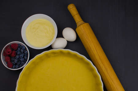 shortbread dough for baking quiche tart and ingredients in baking formの写真素材