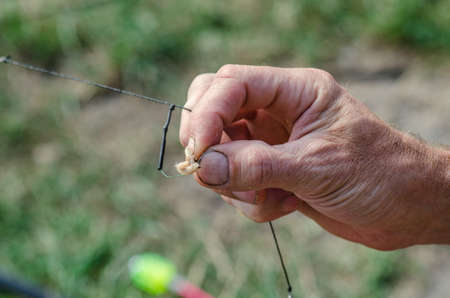 spinner with a triple hook for fishing in the handの写真素材