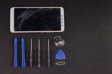 smartphone repair on black background.の写真素材
