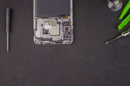 smartphone repair on black background.の写真素材