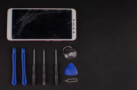 smartphone repair on black background.の写真素材