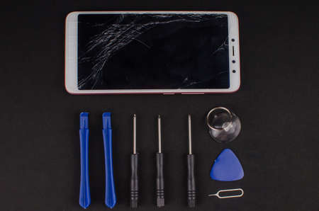 smartphone repair on black background.の写真素材