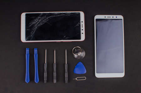 smartphone repair on black background.の写真素材