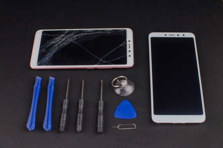 smartphone repair on black background.の写真素材