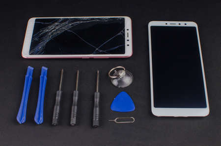 smartphone repair on black background.の写真素材