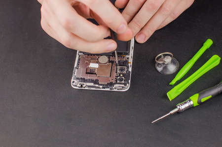 smartphone repair on black background.の写真素材