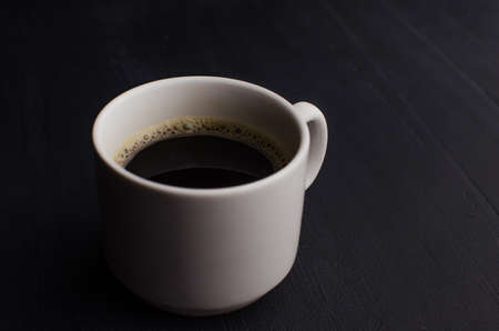 Black closeup on dark backdrop. Coffee espresso on dark background. Space texture.の写真素材