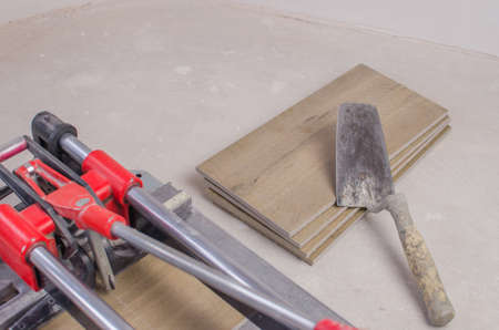 Tile cutter with ceramic tiles and ruler. Close upの写真素材