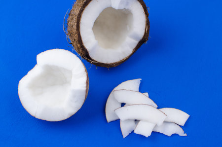 Close-up coconut, coconut shavings and coconut chips on a blue background. .