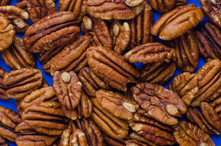 Pekan nuts background. Closeup pekan seeds. Top view