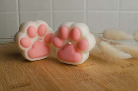 soy candle in the form of a cats pawの写真素材