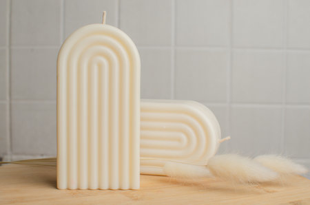 a candle made of soy wax in the form of an arch. beautiful home decorの写真素材