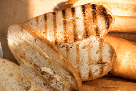 slices of toasted bread on the gridironの写真素材