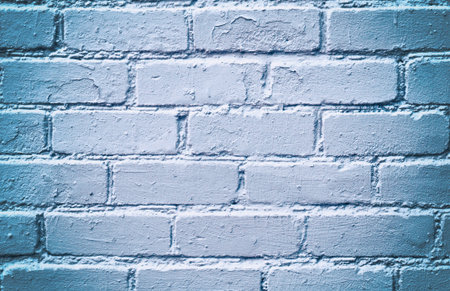 White brick wall with a blue tint.の写真素材