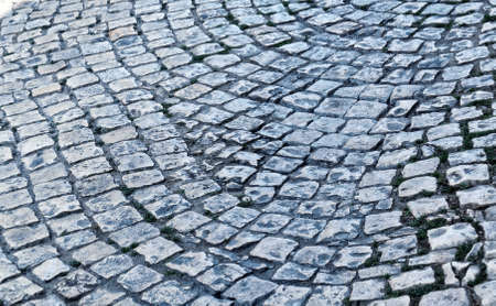 Old cobblestone pavement close-up. Texture for paving stone. Abstract structured background.の写真素材