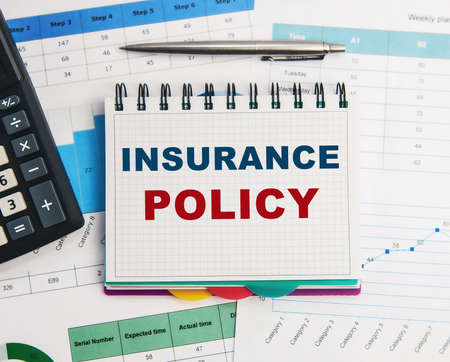 Insurance policy form on desk in office showing risk concept.の写真素材
