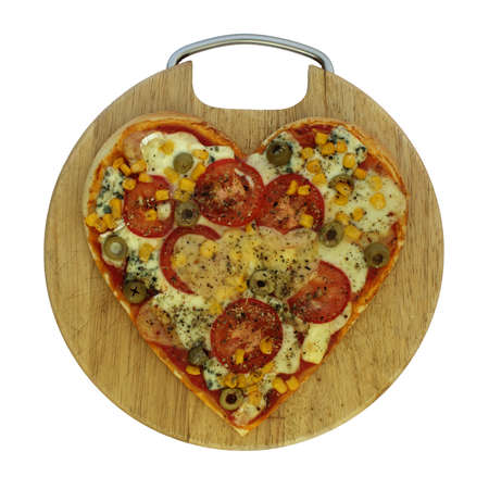 Photo of vegetarian pizza in the shape of heart の写真素材