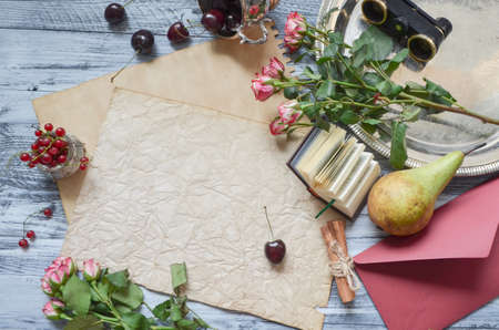 Vintage paper mock up on rustic wood background with natural style decorations. Berries and fruits border. Blank template, art letters, background space for text, vintage mock up.の写真素材