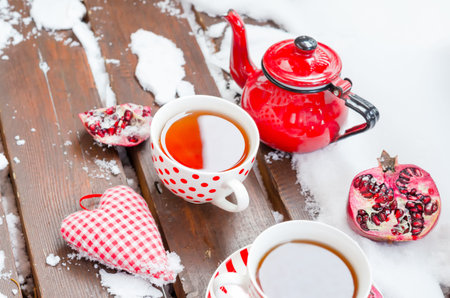 Vintage Heart, Hot Cup of Tea on the Snow, Red Teapotの写真素材