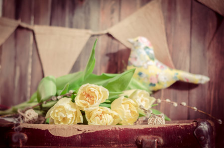 The spring flowers and a textile bird