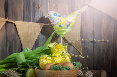 The bird and flowers tulips with eggs