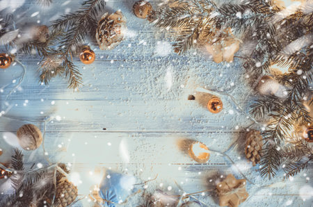 From above shot of coniferous twigs composed with Christmas baubles and other decor in snow. Top viewの写真素材