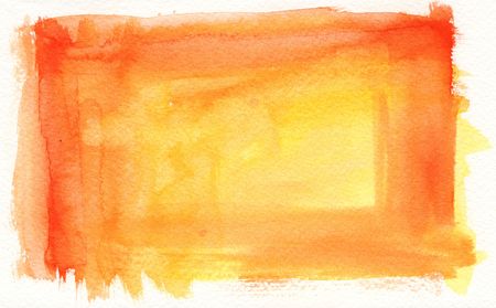 orange watercolor background on textured paper frameの写真素材