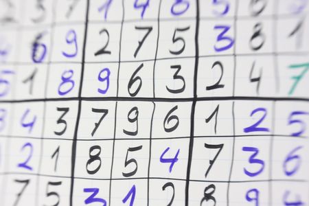 selective focus photo of selfmade sudoku game on flipchart paperの写真素材