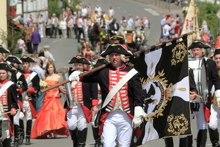 BAD AROLSEN-HELSEN, GERMANY - MAY 24: people historic clothing taking part in the pageant of a fair featuring shooting matches , Helser Freischiessen 2010 May 24, 2010 in Bad Arolsen-Helsen, Germanyのeditorial素材