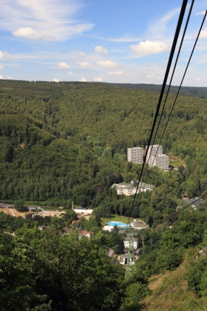 BAD HARZBURG, GERMANY - JULY 28: view along the cables of mount burgberg cable car to the bad harzburg valley station  , Burgberg June 28, 2011 in Bad Harzburg, Germanyのeditorial素材