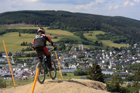 WILLINGEN, GER - JUNE 17, unknown competitor , racing at downhill qualification,Willingen in the background, Willingen, Germany, June 17, 2011 のeditorial素材
