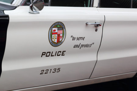 FEHMARN, LOWER SAXONY, GERMANY - SEPTEMBER 08: door of a classic police car from los angeles showing the motto のeditorial素材