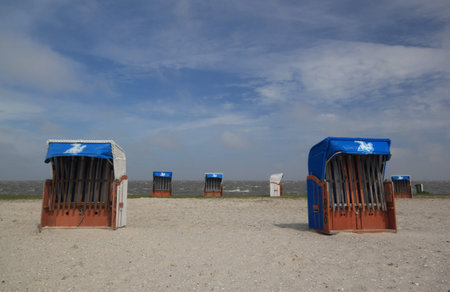 empty beach chairs on a sunny but cool day at the german north sea coastのeditorial素材