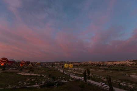 hot air balloon trip at famous cave house Cappadocia Turkeyの写真素材