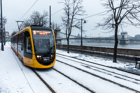 Budapest, Hungary, March 15 jan 2019 Old yellow Tram and chain bridge at winterのeditorial素材
