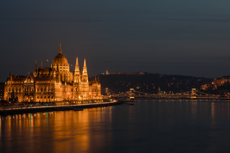 A view of Hungarian Parliament building and Danube river at night.の写真素材