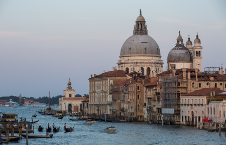Venice city scene with Canal Grande, traditional gondolas and Basilica di Santa Maria della Salute at day time Venice Italyの写真素材