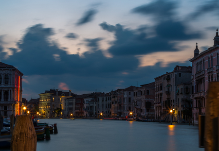 A view of beautiful Grand Canal at dusk in old city Venice, Italyの写真素材