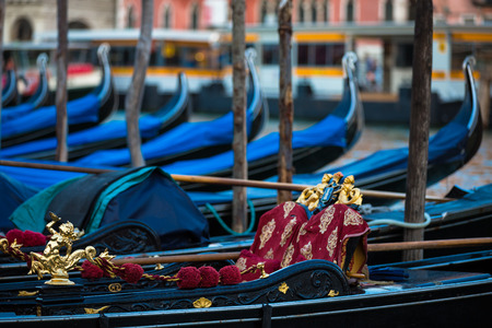 A view of famous Traditional Venice gondolas parking on grand canalの写真素材