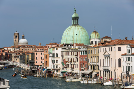 A view of Venice city with Grande canal and Basilica di Santa Maria della Salute at sunny summer time Venice Italyの写真素材