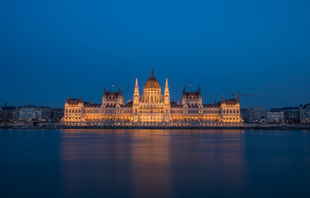 A view of Hungarian Parliament building and Danube river at night.の写真素材