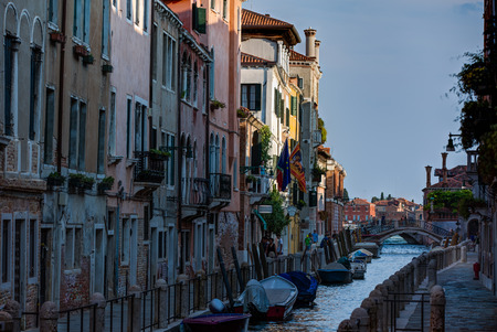 Venice city scape with narrow streets, bridges,buildings and boats on canal in beautiful romantic city  Venice Italy at sunny summer dayの写真素材